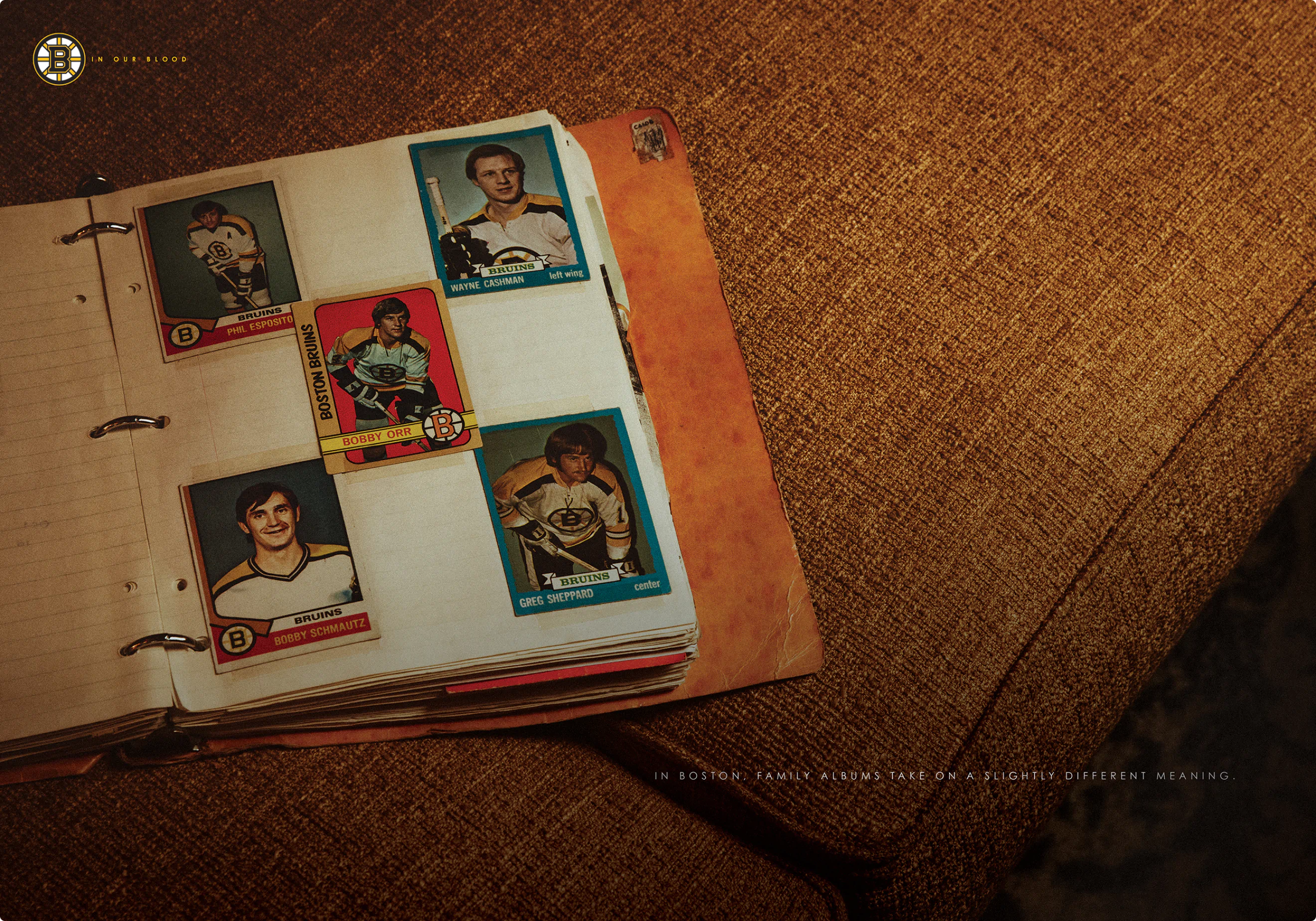 "In Our Blood" ad campaign print ad by Colossus. A picture of a binder of old hockey cards.