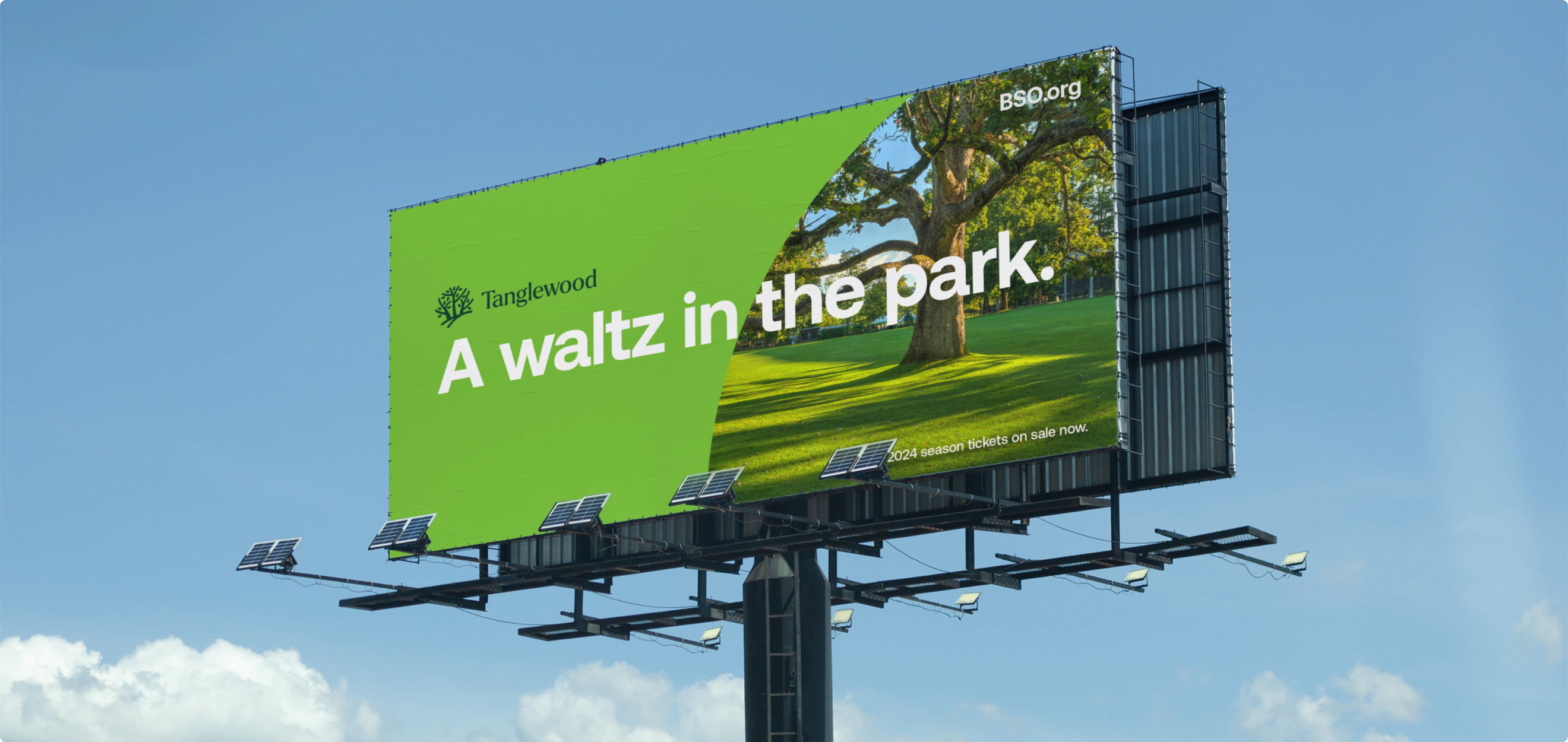 A billboard for Tanglewood that reads "A waltz in the park." The design is a part of the BSO Brand Identity designed by Colossus Creative Co.