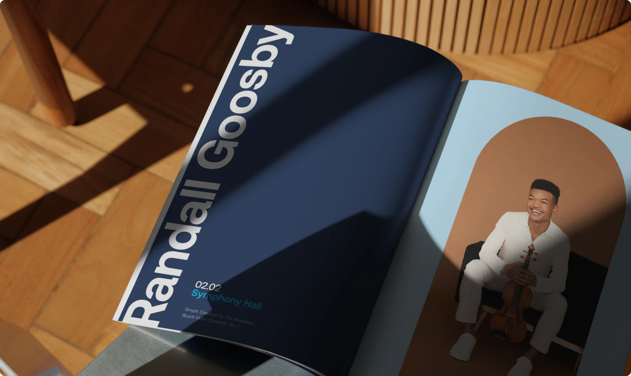 An elegant magazine spread on a midcentury coffee table. The sophisticated design features Randall Goosby. The design is a part of the BSO Brand Identity designed by Colossus Creative Co.