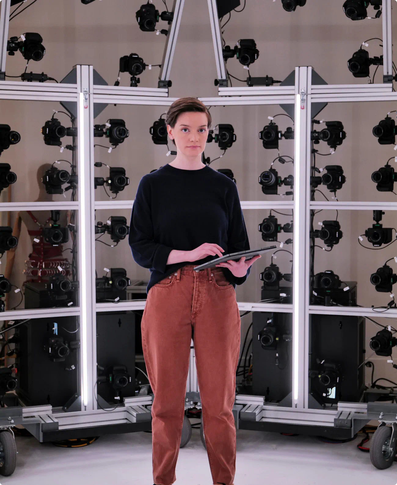 Image of a female model in the photography cage. Similar to the technique used in the intro to Apple TVs "Severance", we used 162 DSL cameras to capture body images of each model.
