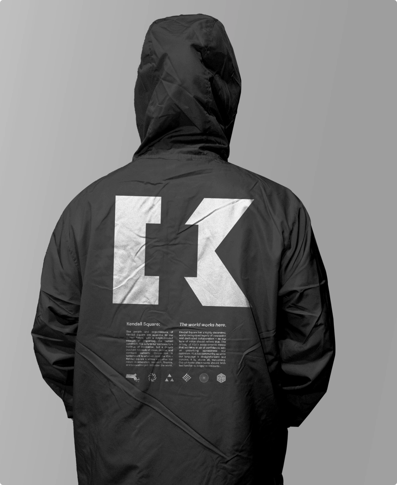 Black windbreaker with white KSA logo on the back. Sleek. Streetwear.