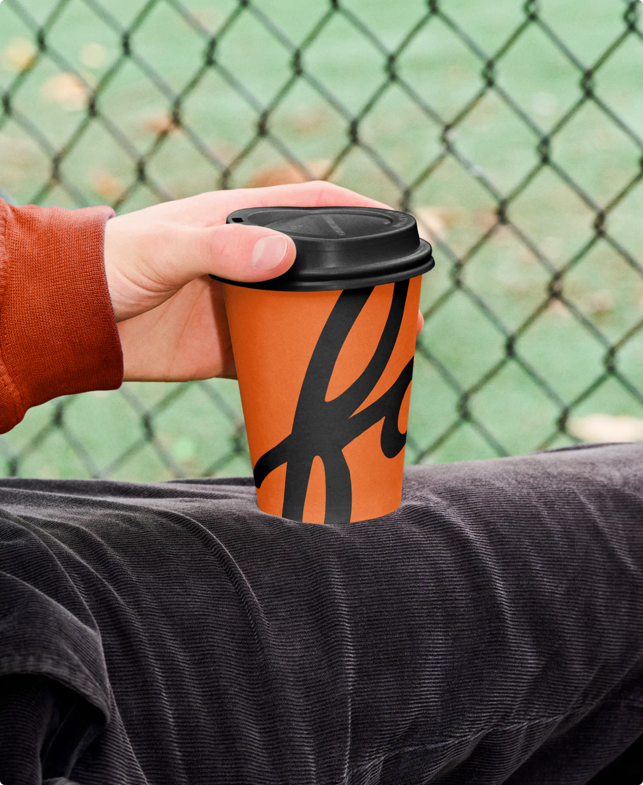 Branded coffee cup for The Faraday. A part of the commercial real estate brand identity for a new development apartment building.