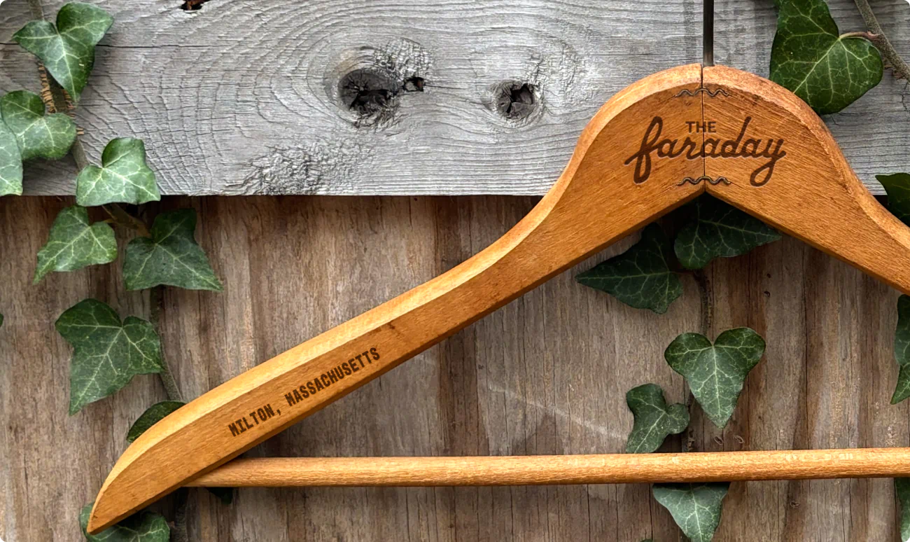 a clothes hanger. branded. merchandise design for The Faraday. A part of the commercial real estate brand identity for a new development apartment building.