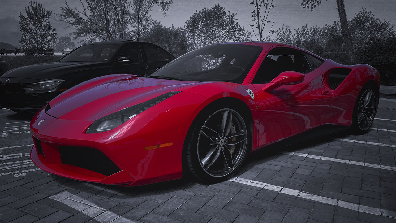 Red Ferrari 488 parked outside Cooper’s Garage during a Cars & Coffee event, with a black BMW parked beside it.