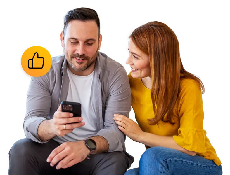 Couple together, man is looking at his phone. Thumbs up Icon.