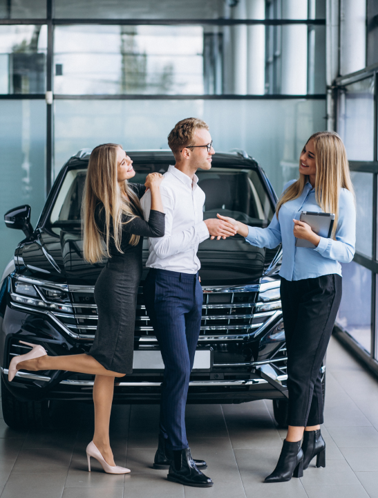 3 People In Front Of A Car