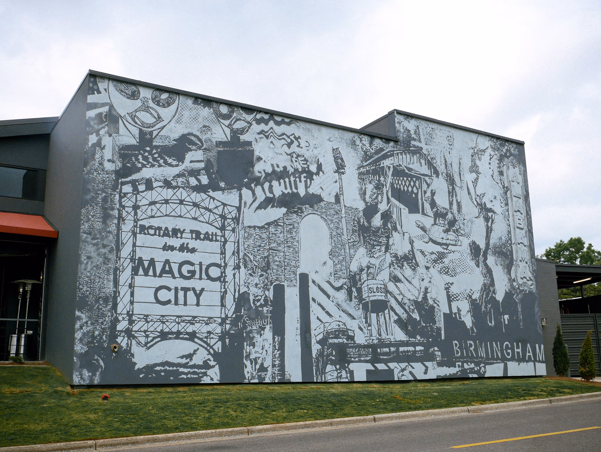 Large-scale exterior mural for Culinary Dropout restaurant featuring artistic food and beverage themes painted by Mammoth Murals in Birmingham, Alabama