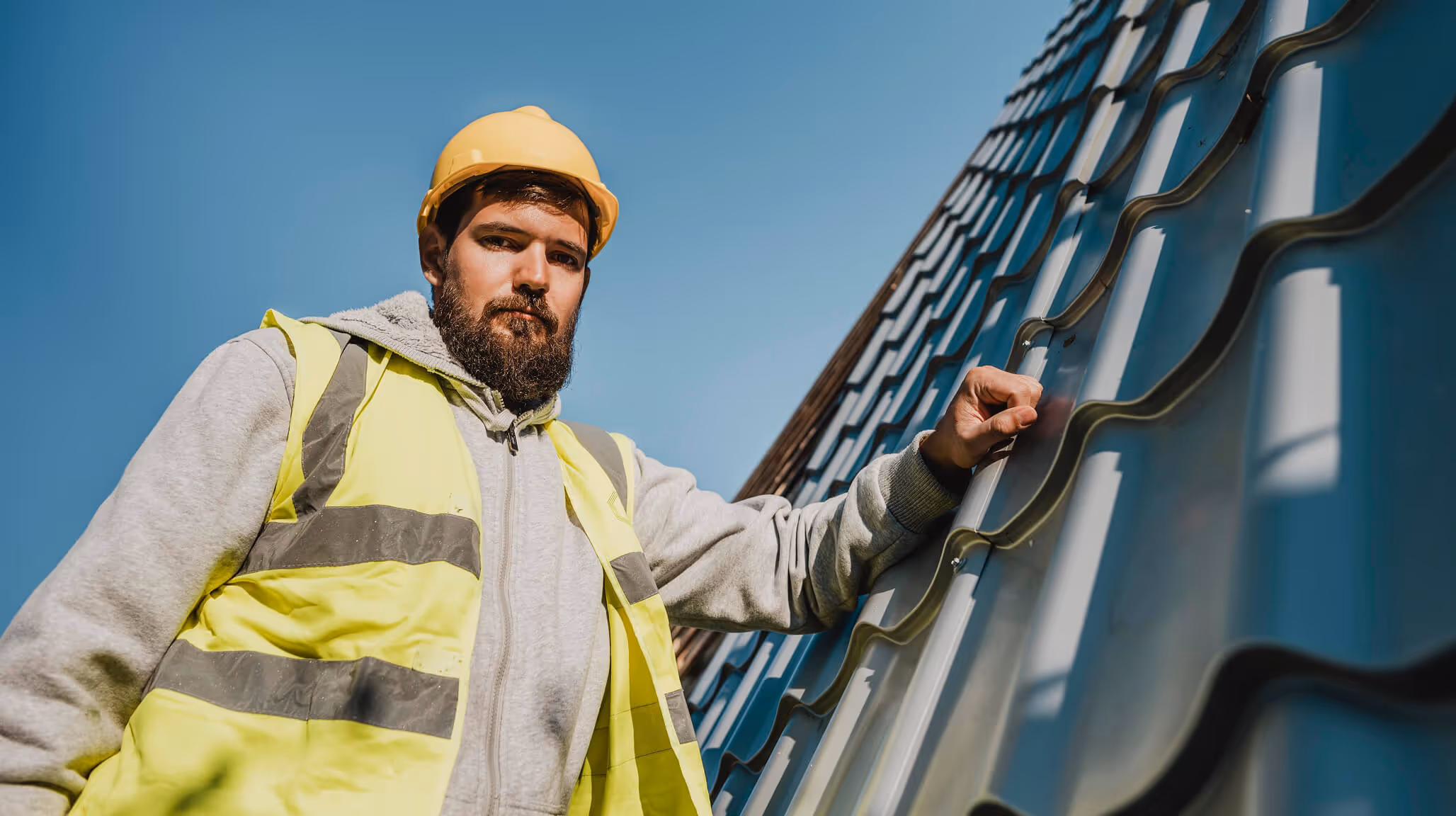 A specialist performs technical maintenance and inspects the roof's condition.