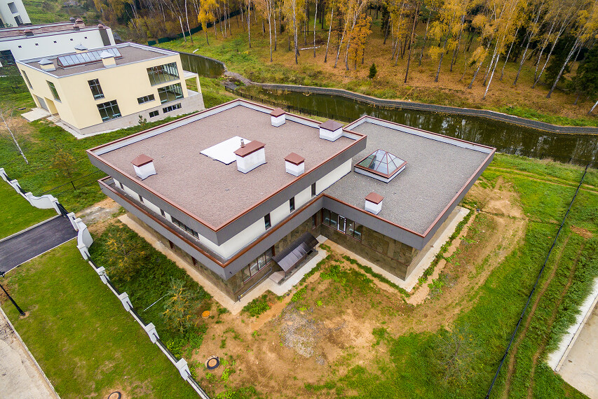 A specialist performs technical maintenance and inspects the roof's condition.