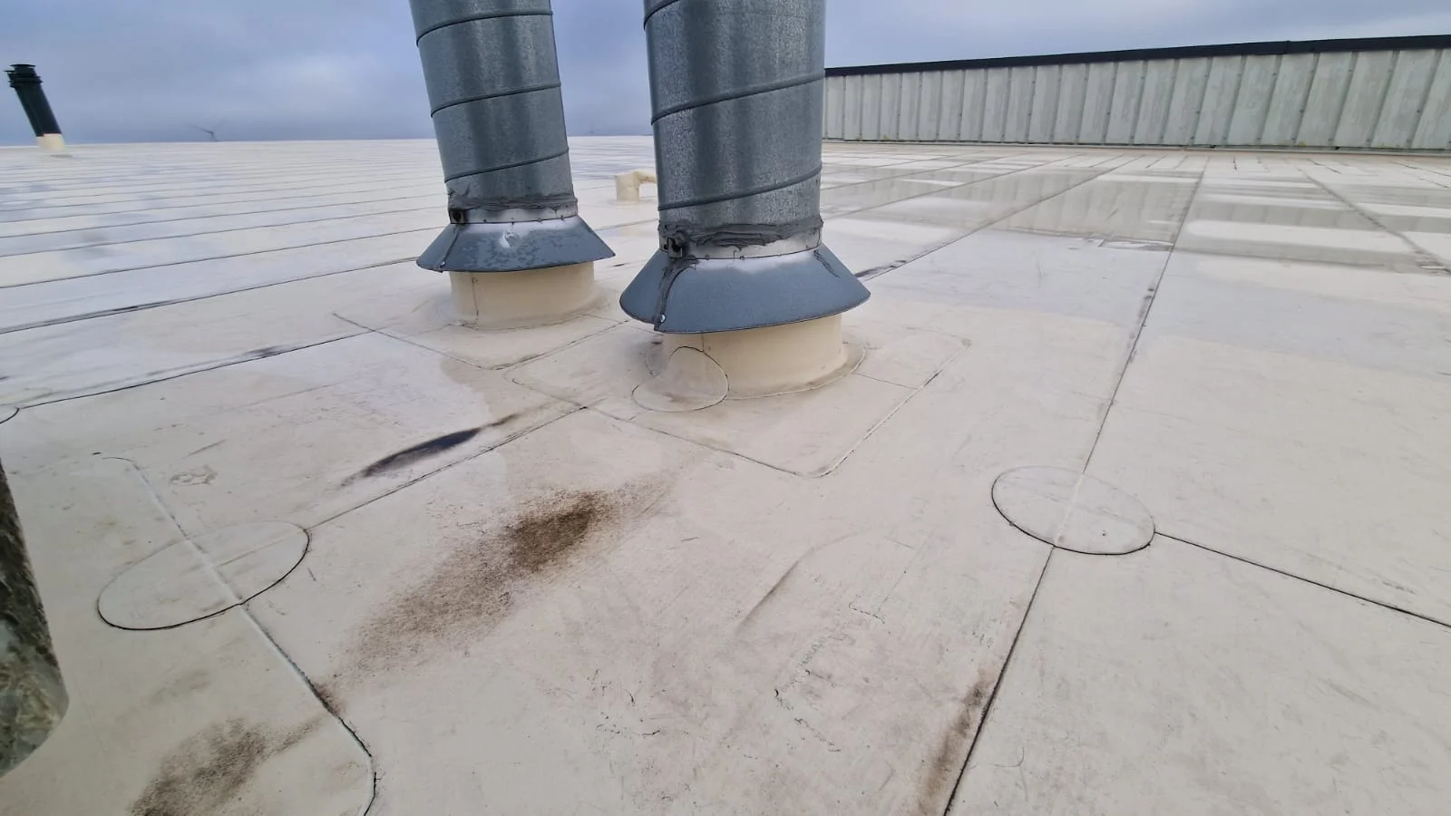 A specialist performs technical maintenance and inspects the roof's condition.