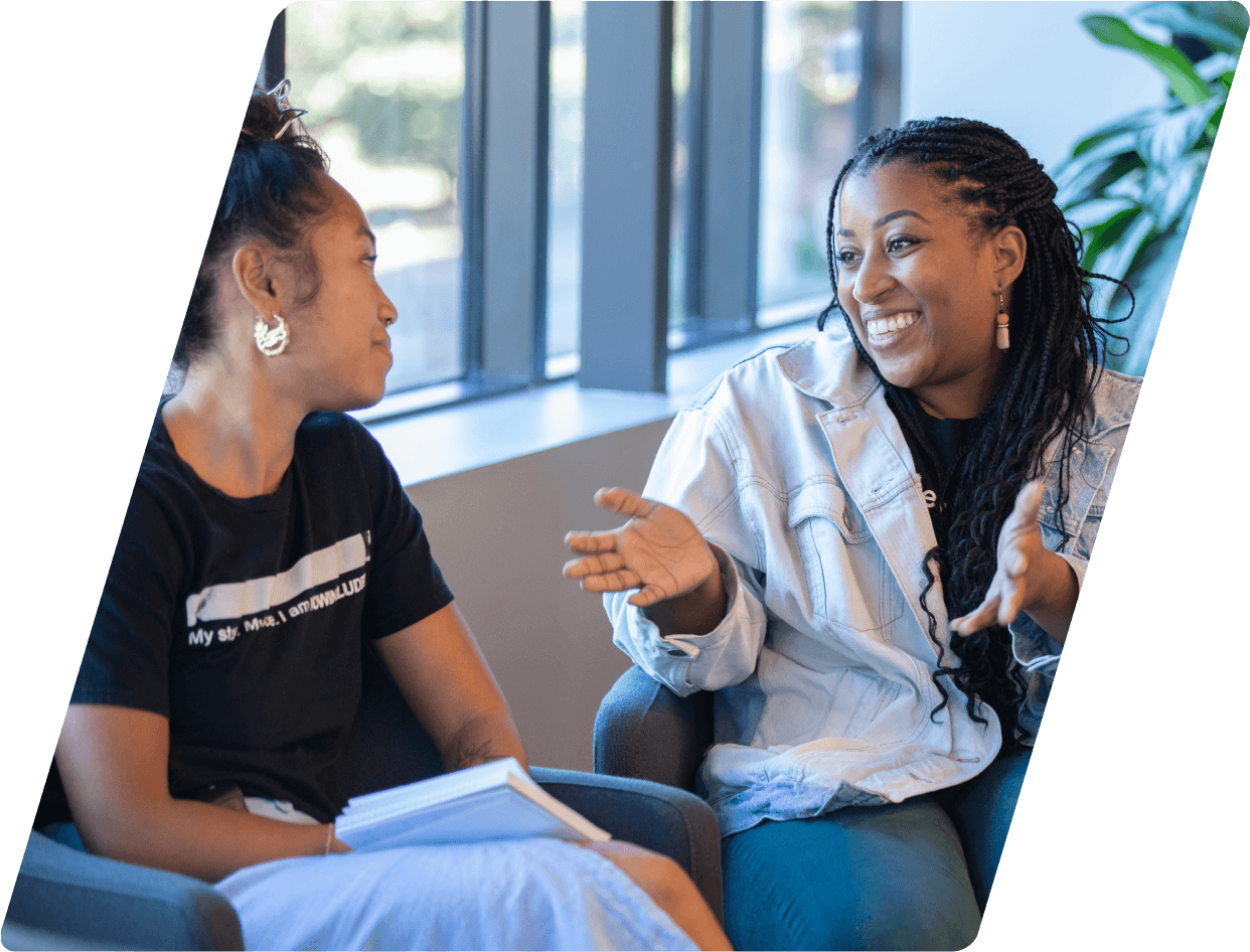 Two female employees talking