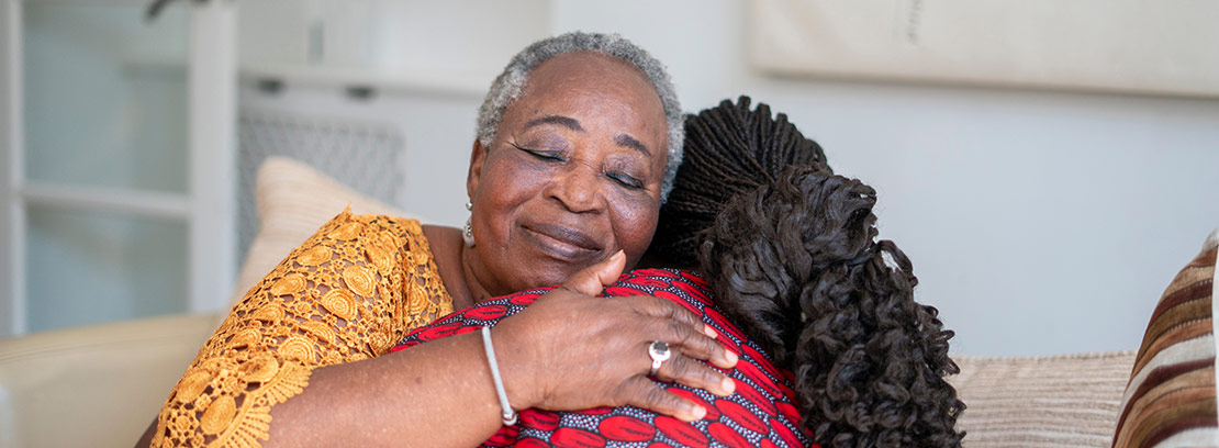 Grandmother hugging her grandchild