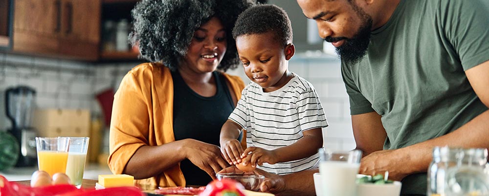 family preparing food in the kitchen