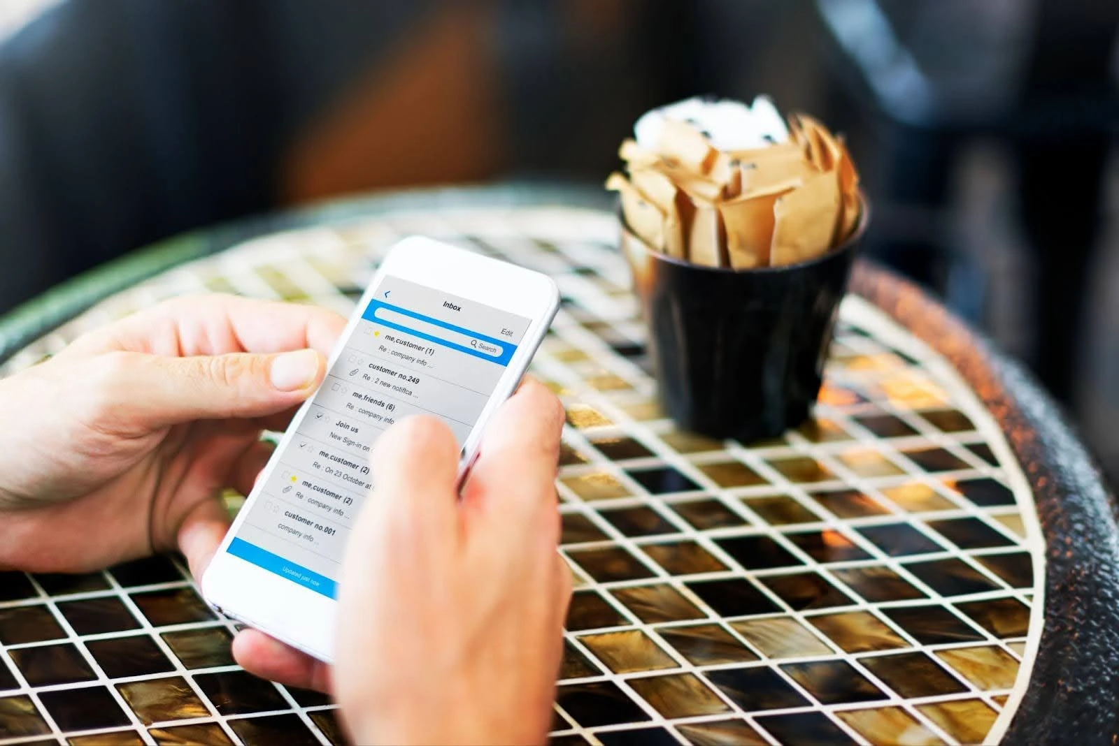 Hotel guest checks messages on phone