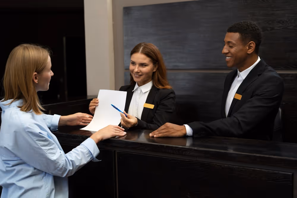 hotel-reception-with-employees-and-guest