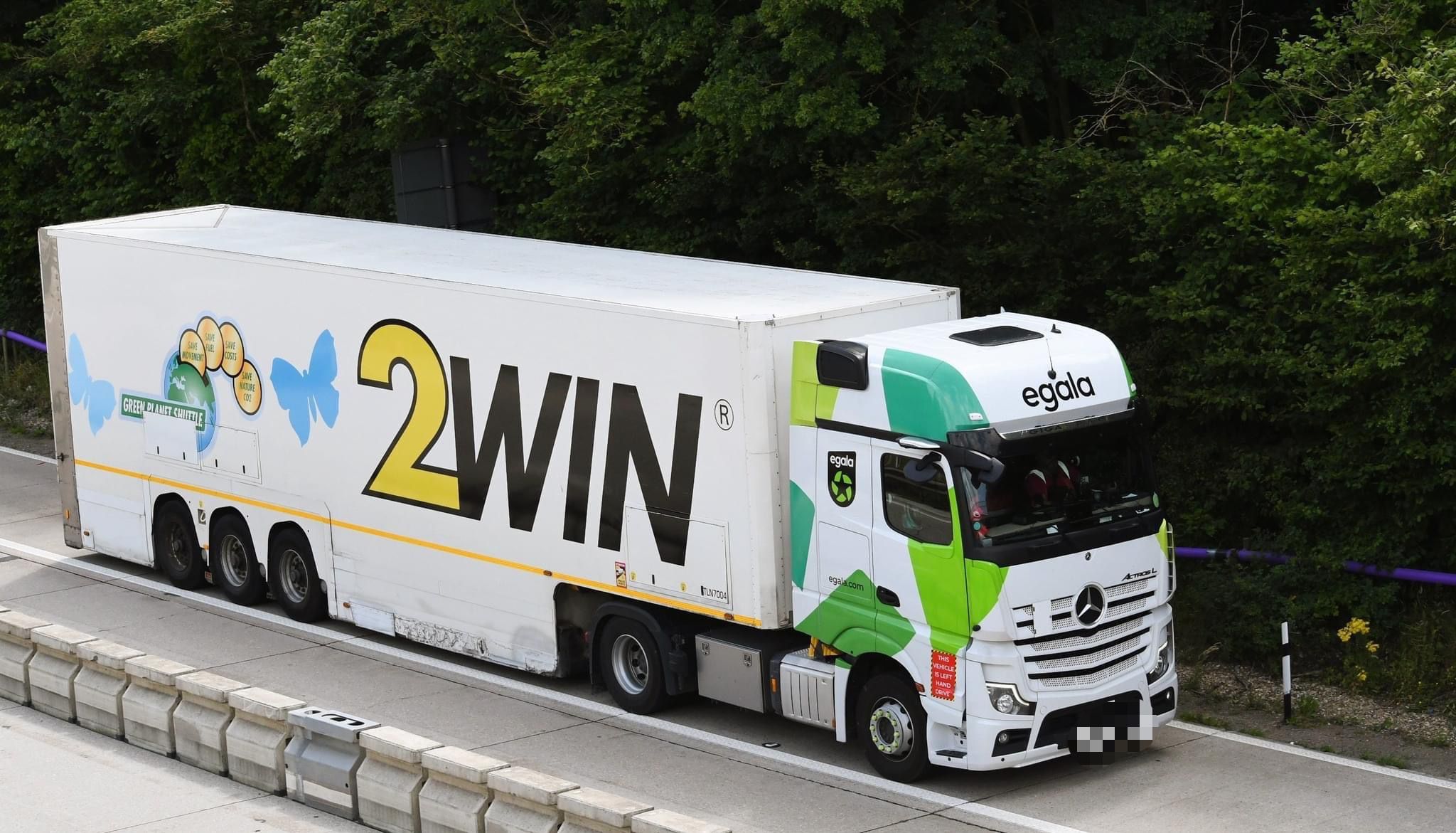 Egala by Boekestijn 2WIN truck driving on a highway, featuring green and white design.