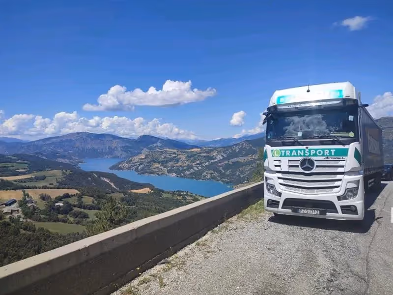 Panoramic view of European mountain landscape with lake, highlighting Egala by Boekestijn’s sustainable transport destinations