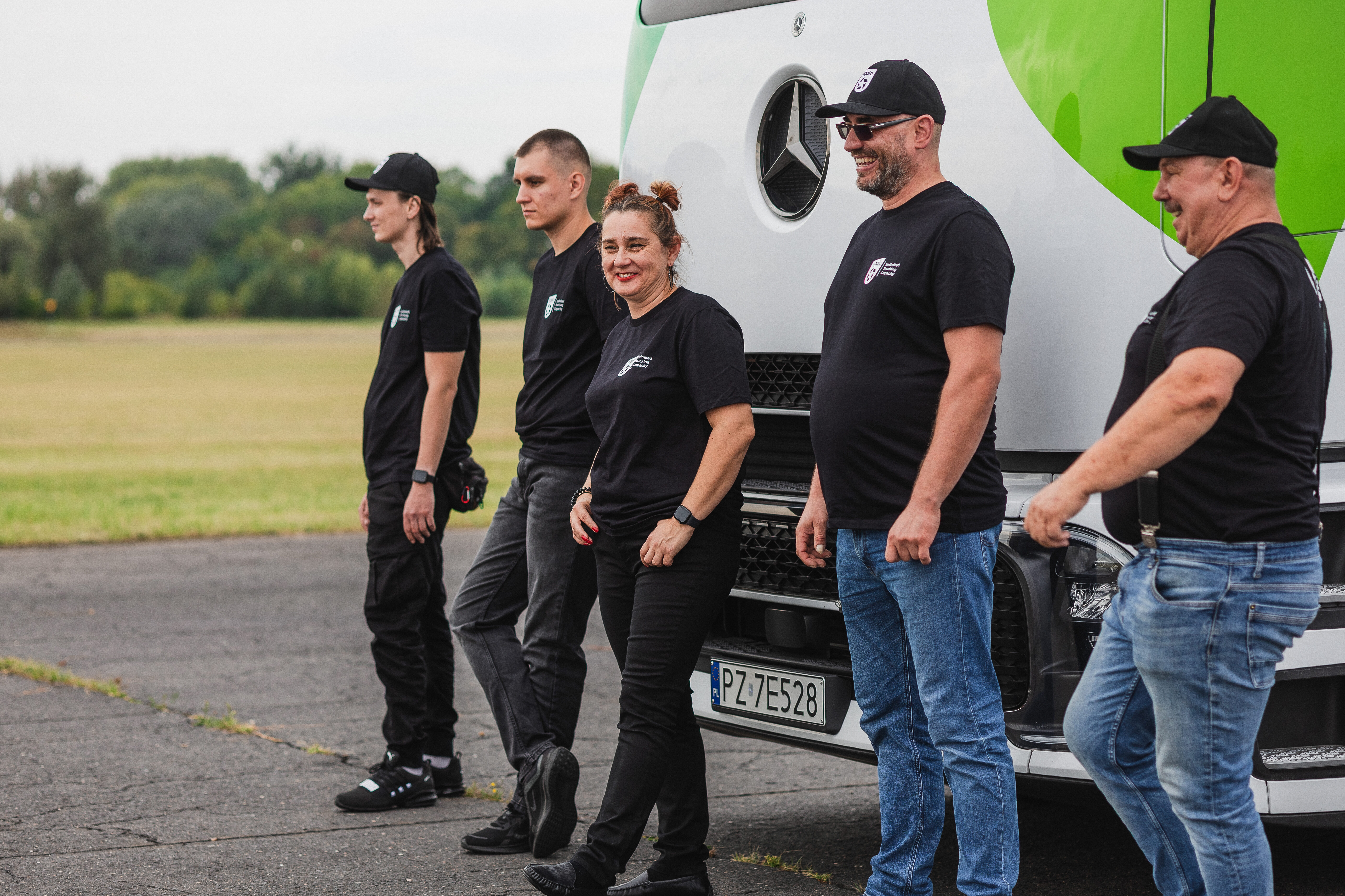 Egala by Boekestijn trucking team standing beside a Mercedes truck — representing professionalism, unity, and pride in European trucking.