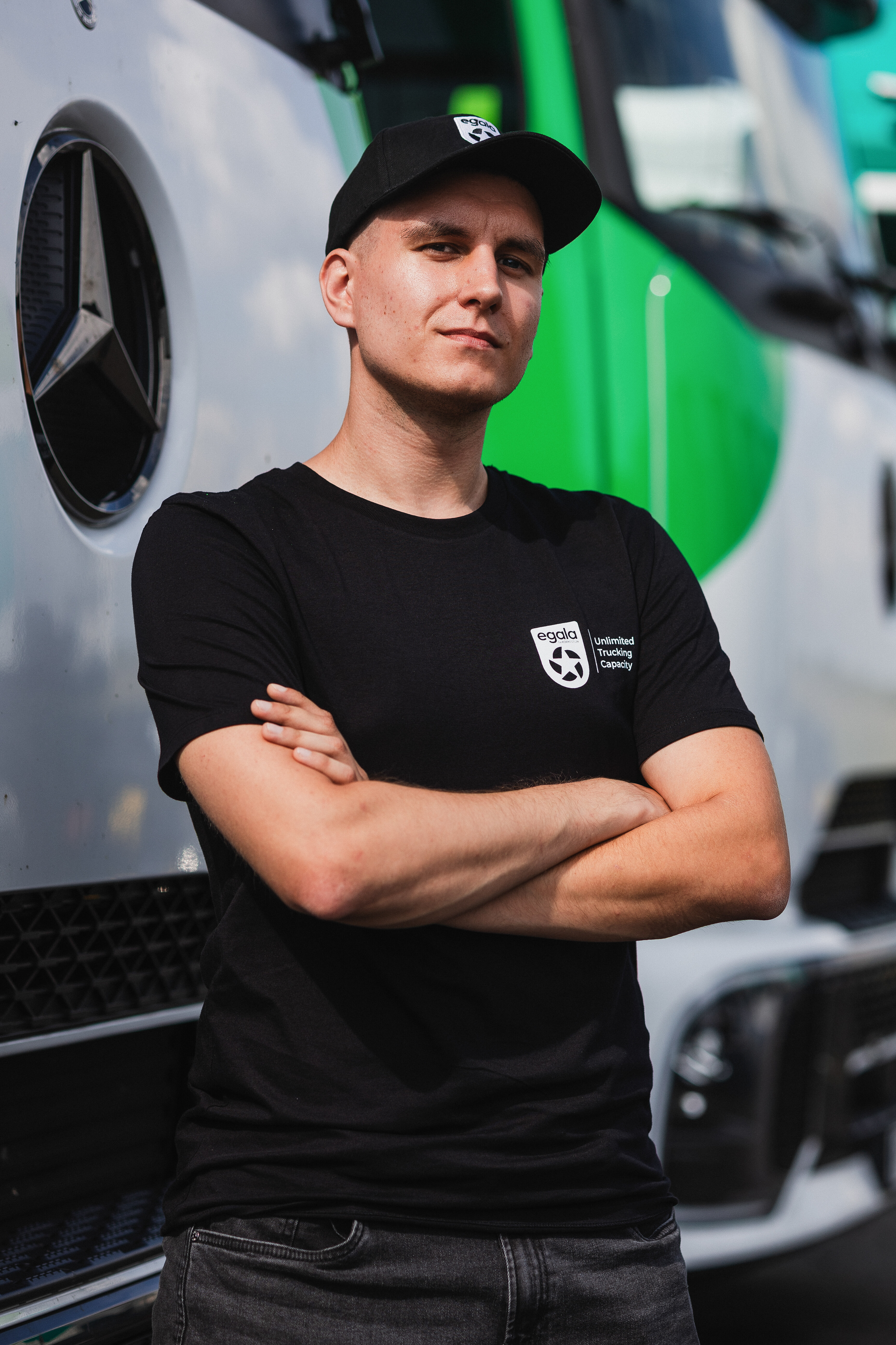 Egala by Boekestijn driver standing near a green and white truck — showcasing unity and equality across the company.