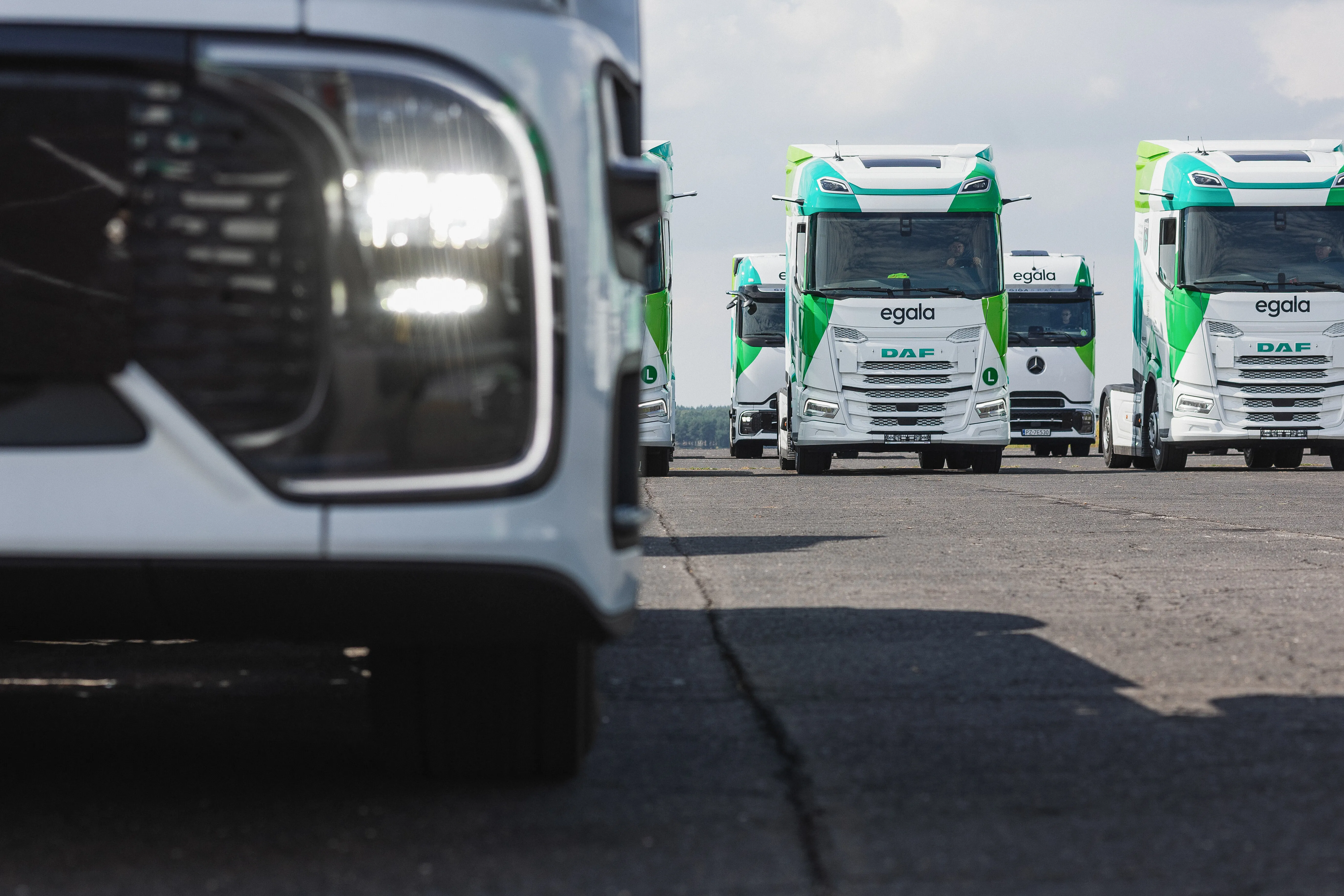 Egala by Boekestijn eco-friendly trucks lined up on the road, showcasing sustainable logistics and modern fleet solutions."