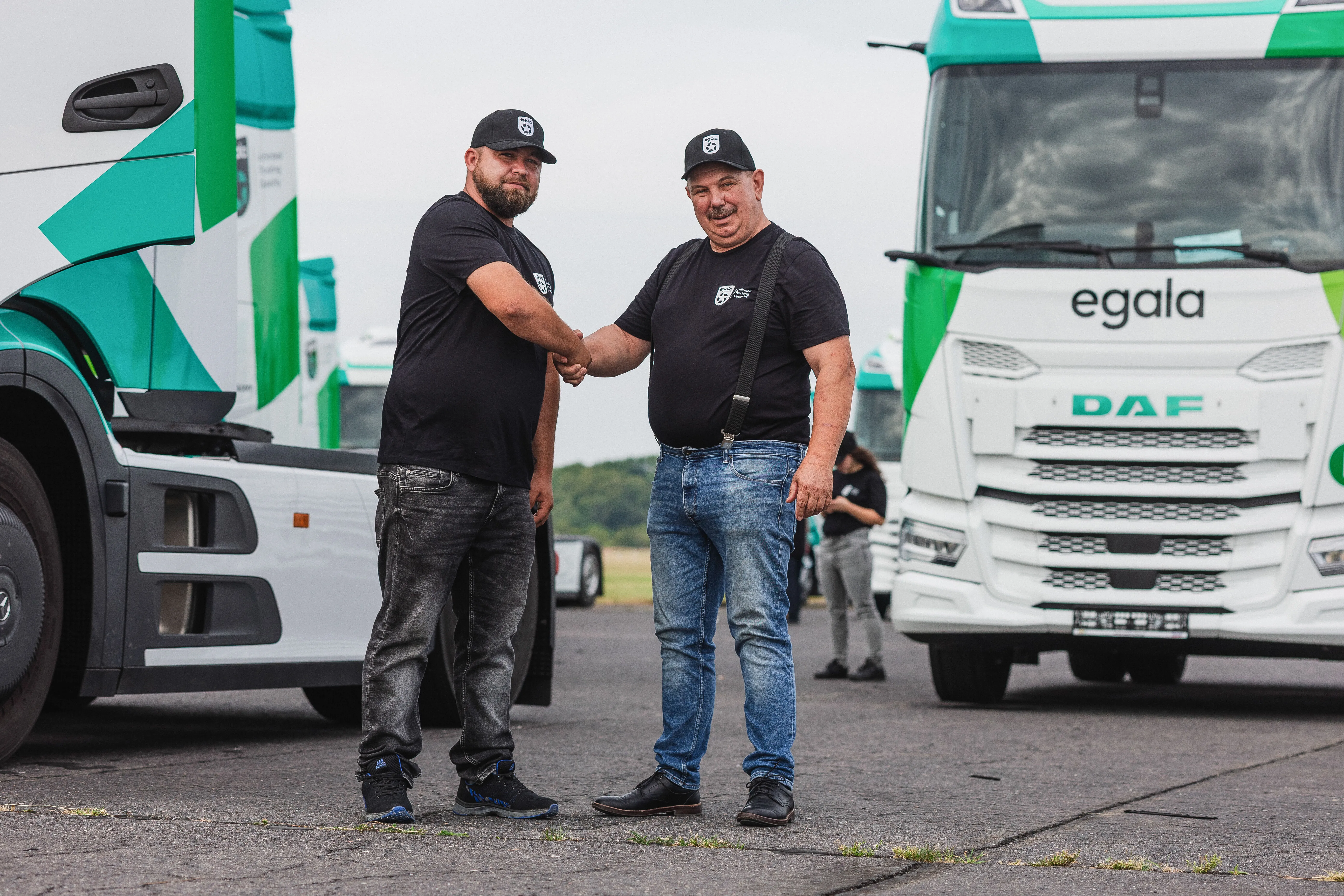 Egala by Boekestijn logistics team reviewing transport documents beside a truck, representing training, collaboration, and operational excellence.