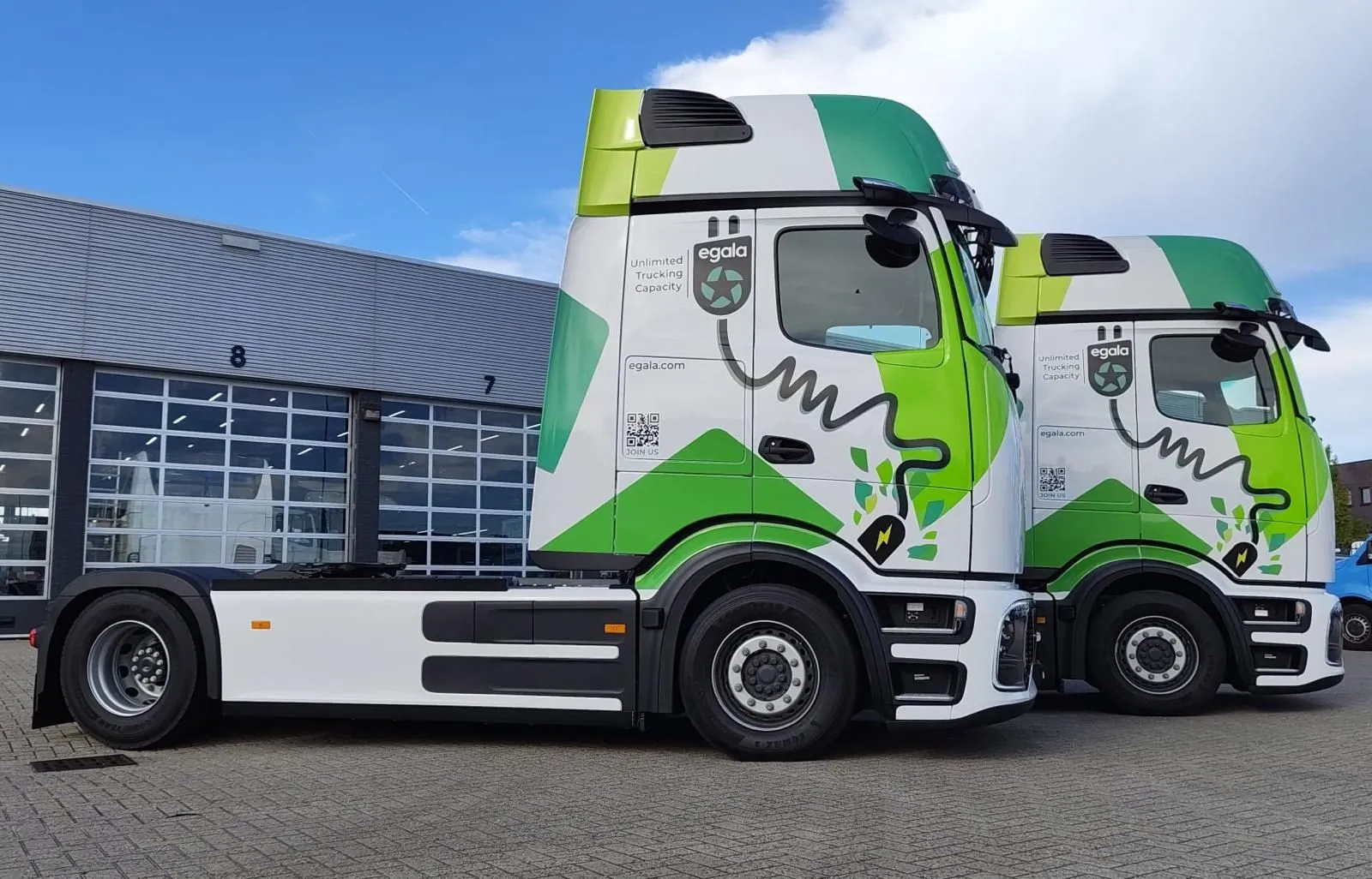 “Egala by Boekestijn electric trucks parked outside the fleet base — modern zero-emission vehicles showcasing commitment to sustainable trucking