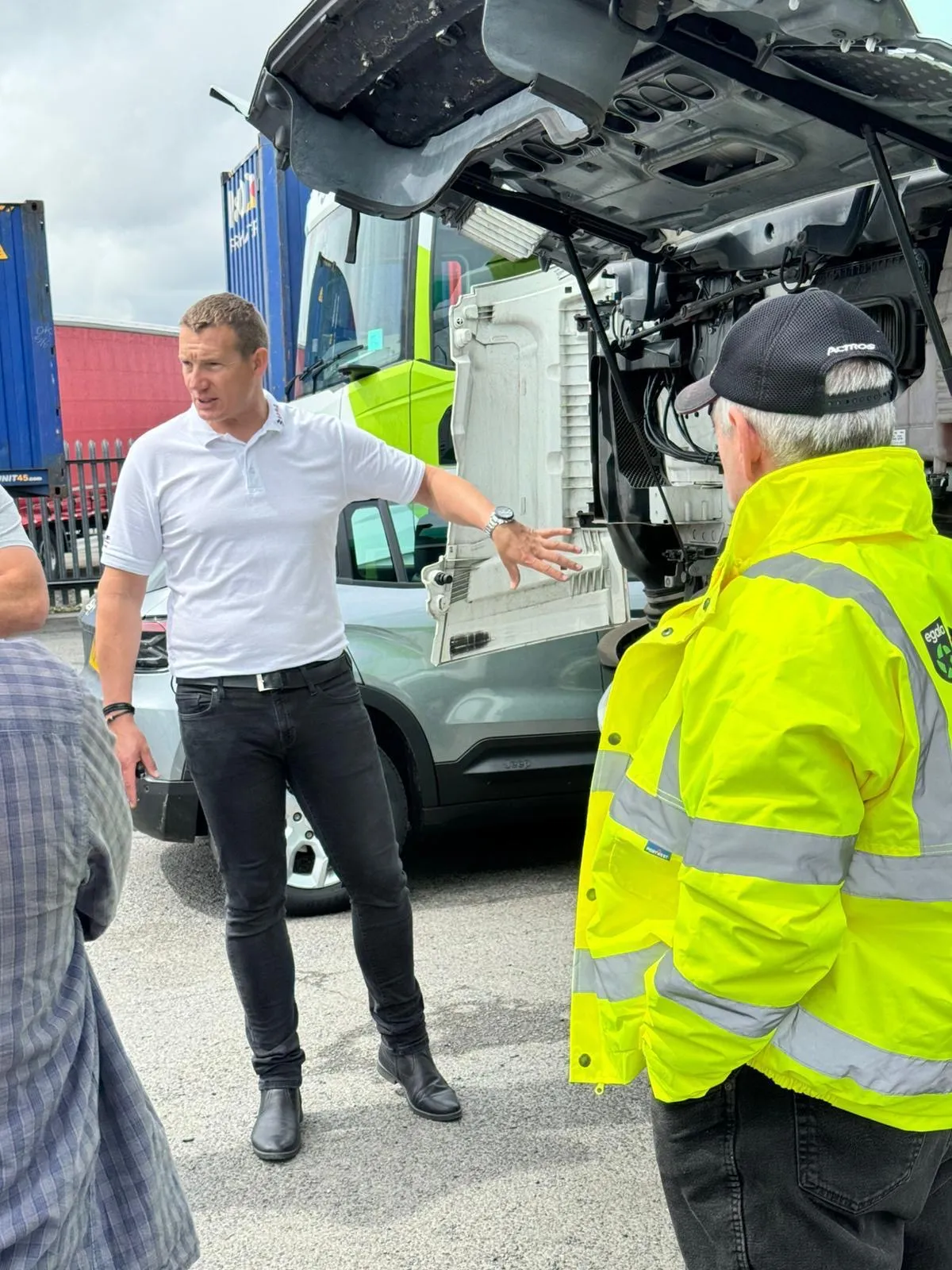 Egala by Boekestijn logistics team reviewing transport documents beside a truck, representing training, collaboration, and operational excellence.