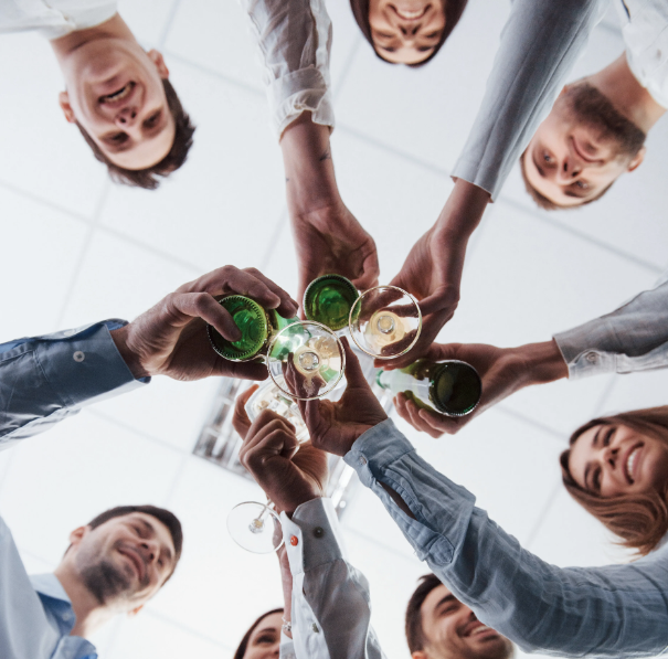 Egala by Boekestijn team celebrating success with a toast, symbolizing collaboration, achievement, and a positive workplace culture.