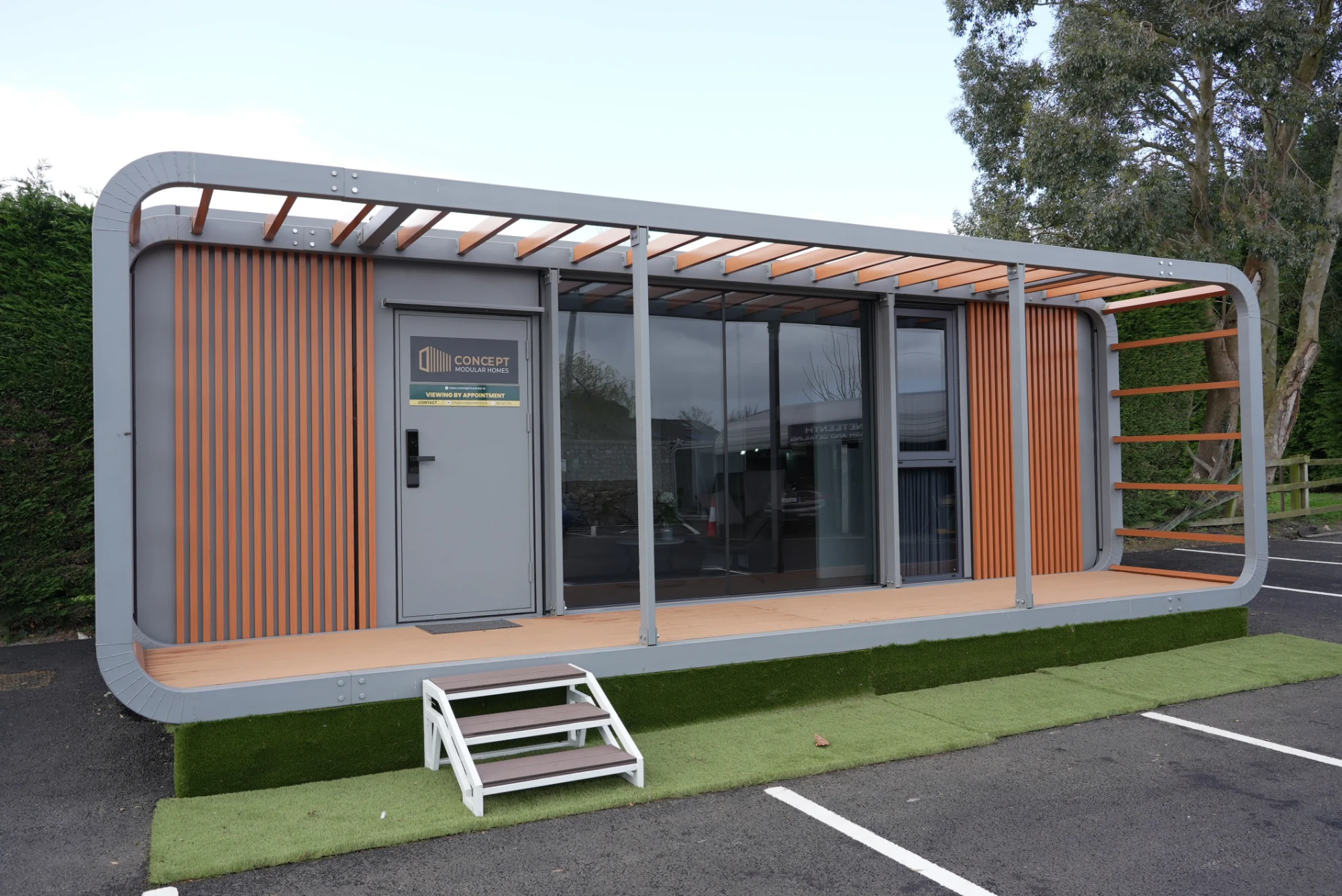 Concept Modular show unit angled view with pergola roof, decked terrace and steps