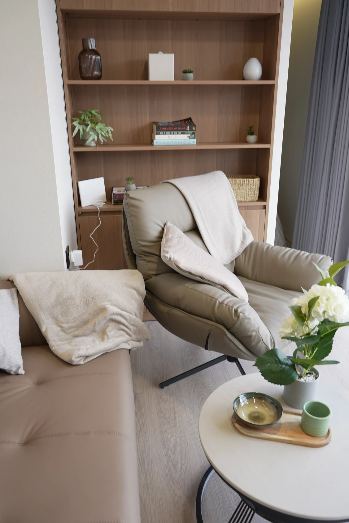 Concept Modular reading corner with lounge chair and fitted timber shelving