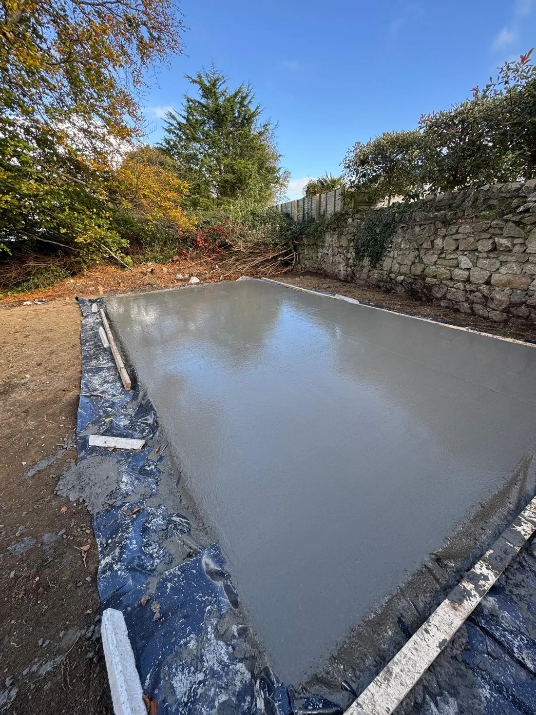 Freshly poured concrete slab over a damp-proof membrane