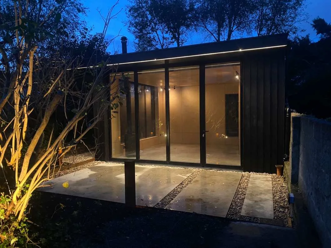 A completed Concept Modular bespoke garden room at dusk