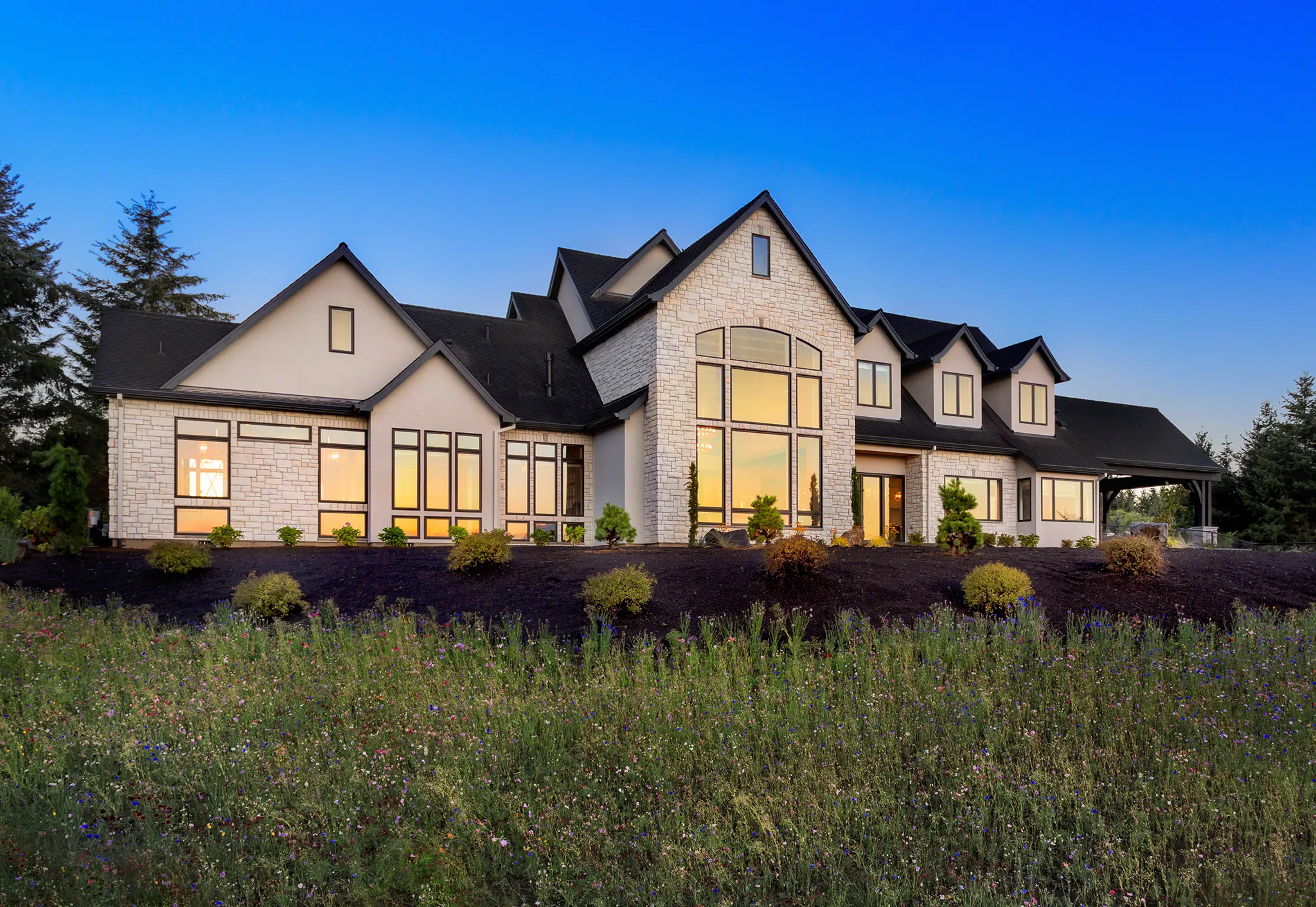 Luxury house at sunset with text Custom and Luxury Residence