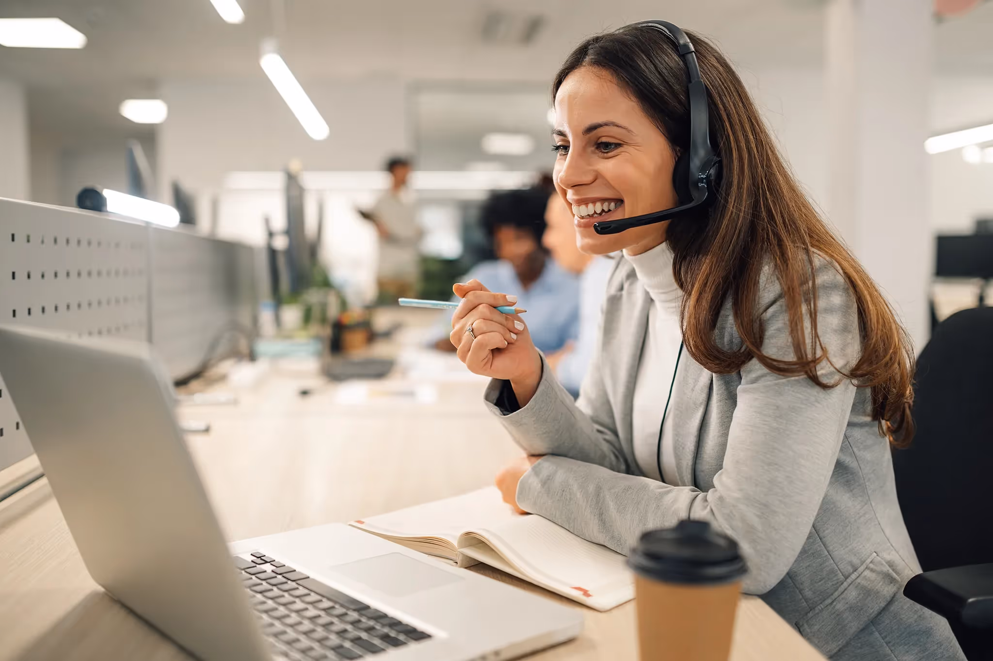 A woman with a headset smiling helping people with their Personal Insurance questions with text Personal Insurance Team