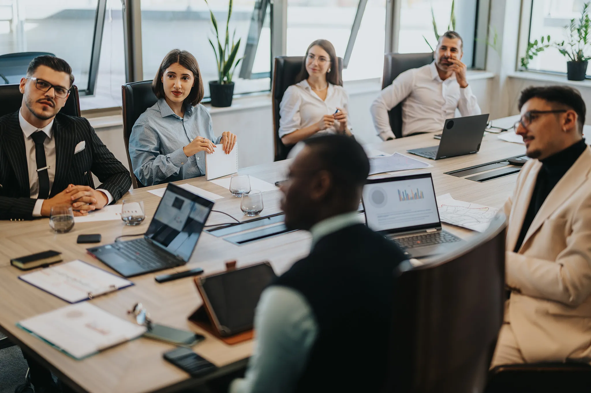 A team meeting in a boardroom to discuss cyber security and how to prevent cyberattacks