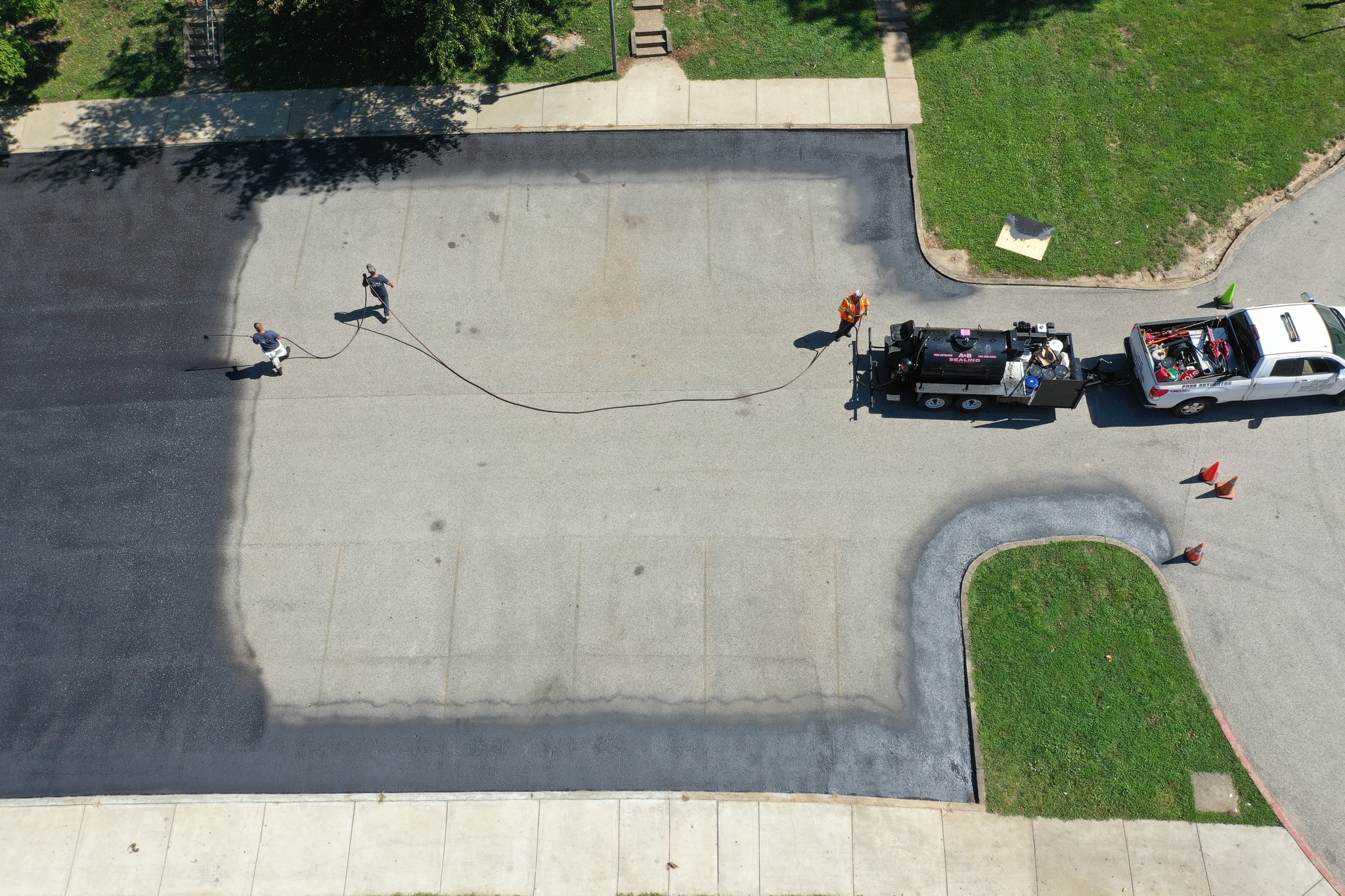A paving job in progress in an apartment complex parking lot.
