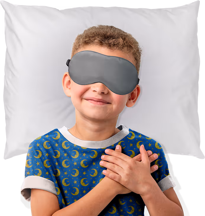 smiling boy wearing pajamas, witha. grey sleep mask