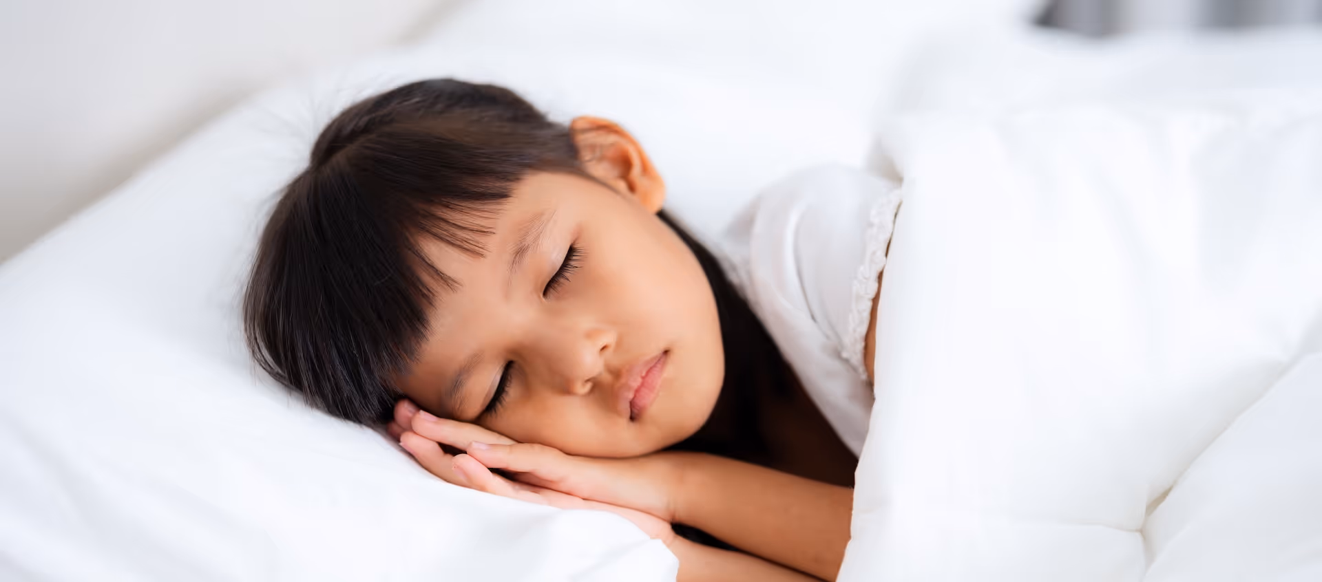 Young girl asleep in bed. Cozy