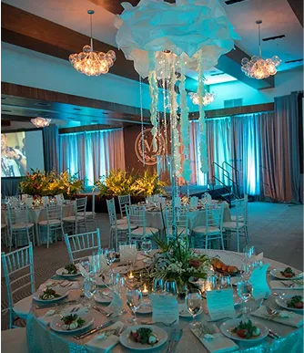 Under the sea themed corporate gala with jellyfish lighting and elegant table settings by Paradym Events