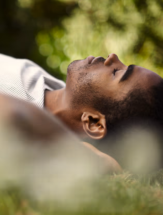 Guy lying down on the grass