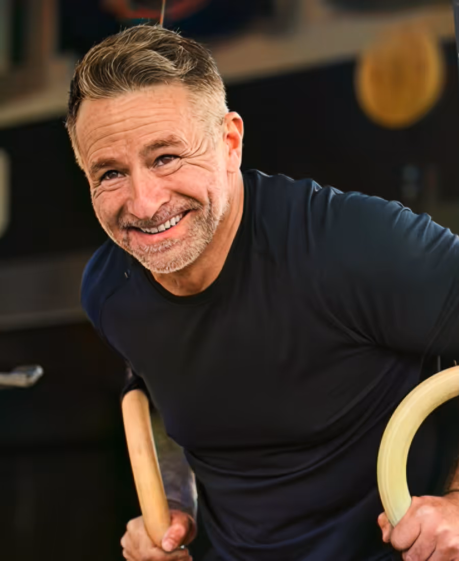 Happy portrait of Dustin Sample exercising
