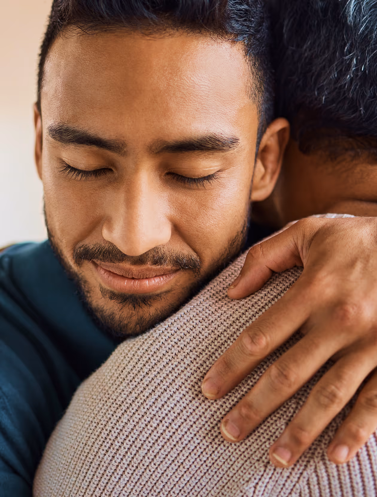 Two Male Friends Hugging and Supporting Each Other