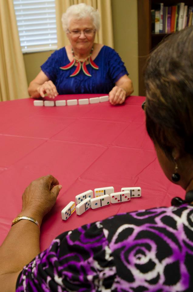 Two residents playing dominoes
