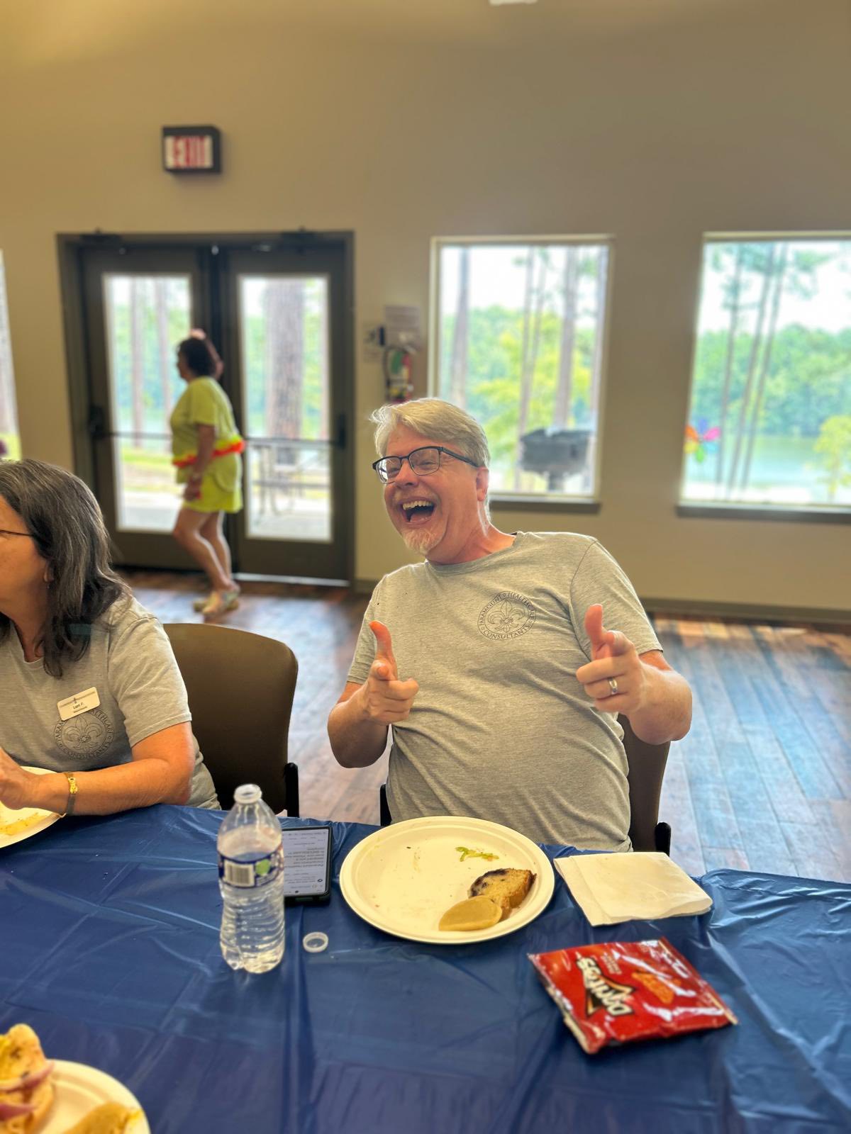 Happy resident eating at a cookout