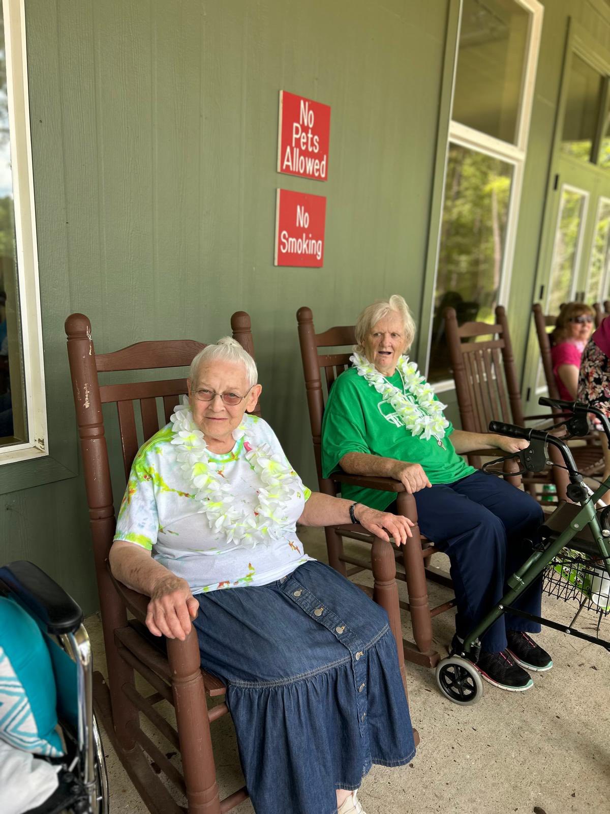 Residents relaxing in rocking chairs