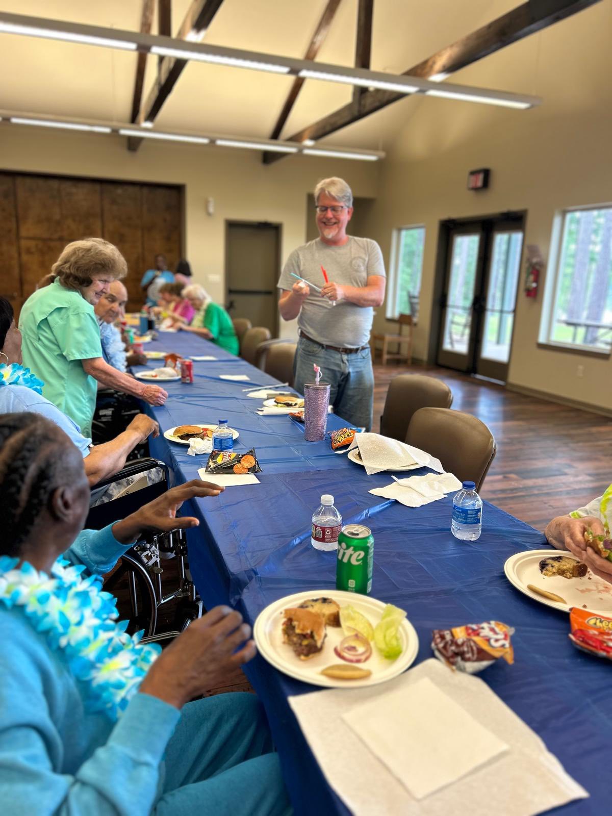 Table of happy residents at a cookout