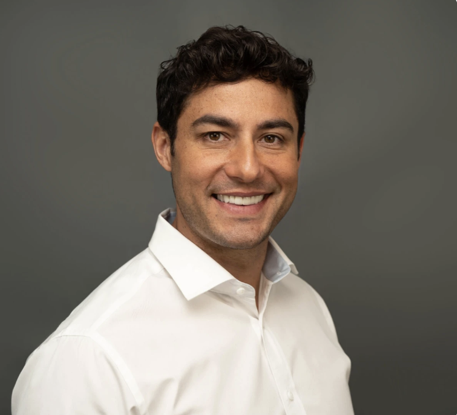 Headshot of male in white button down shirt