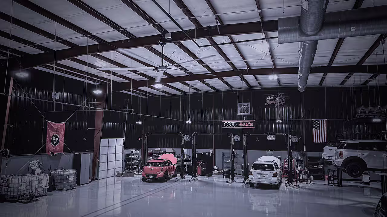 Interior view of Cooper’s Garage service bay during an event