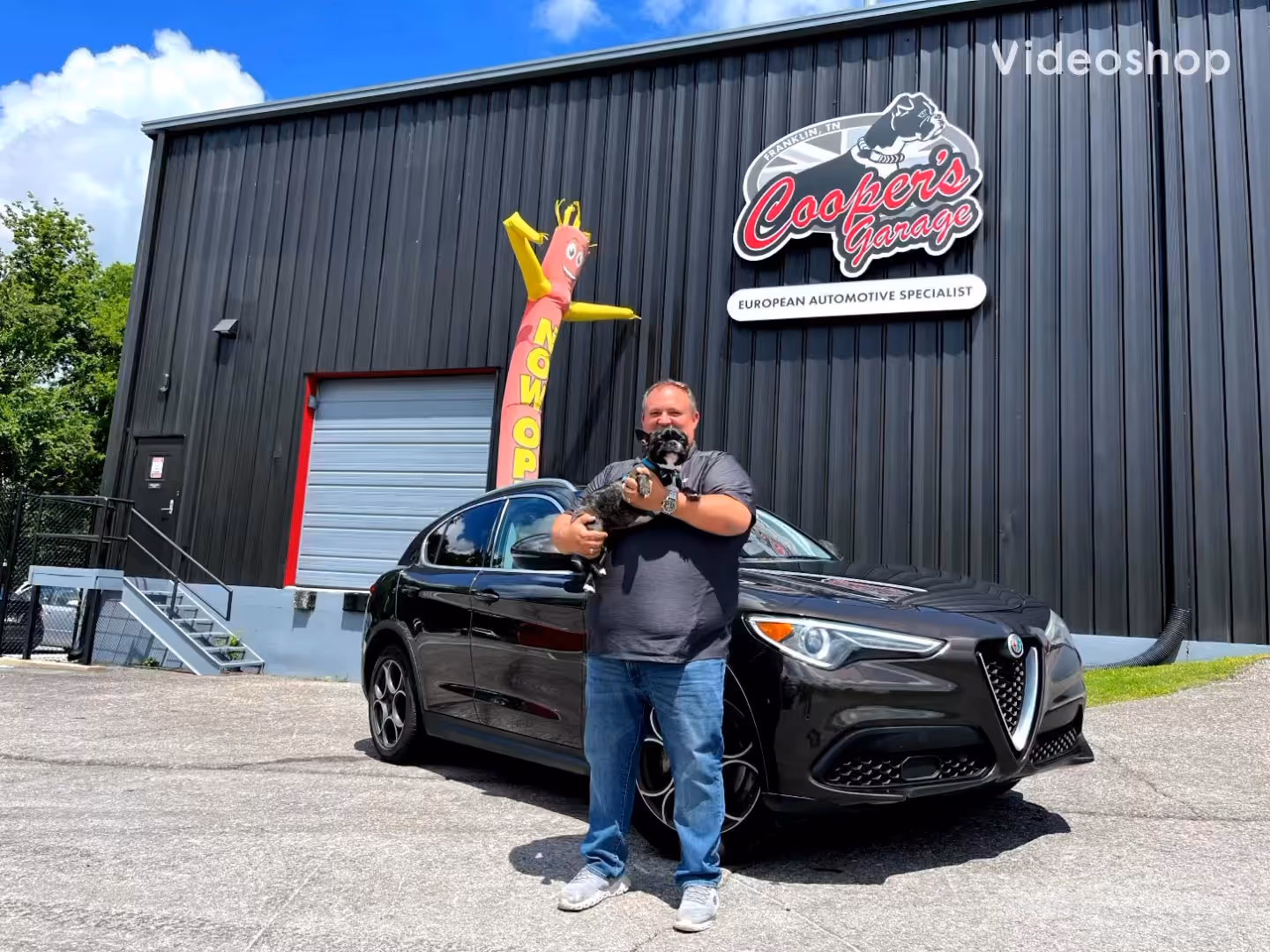 Alfa Romeo Stelvio with owner outside Cooper’s after baseline service.