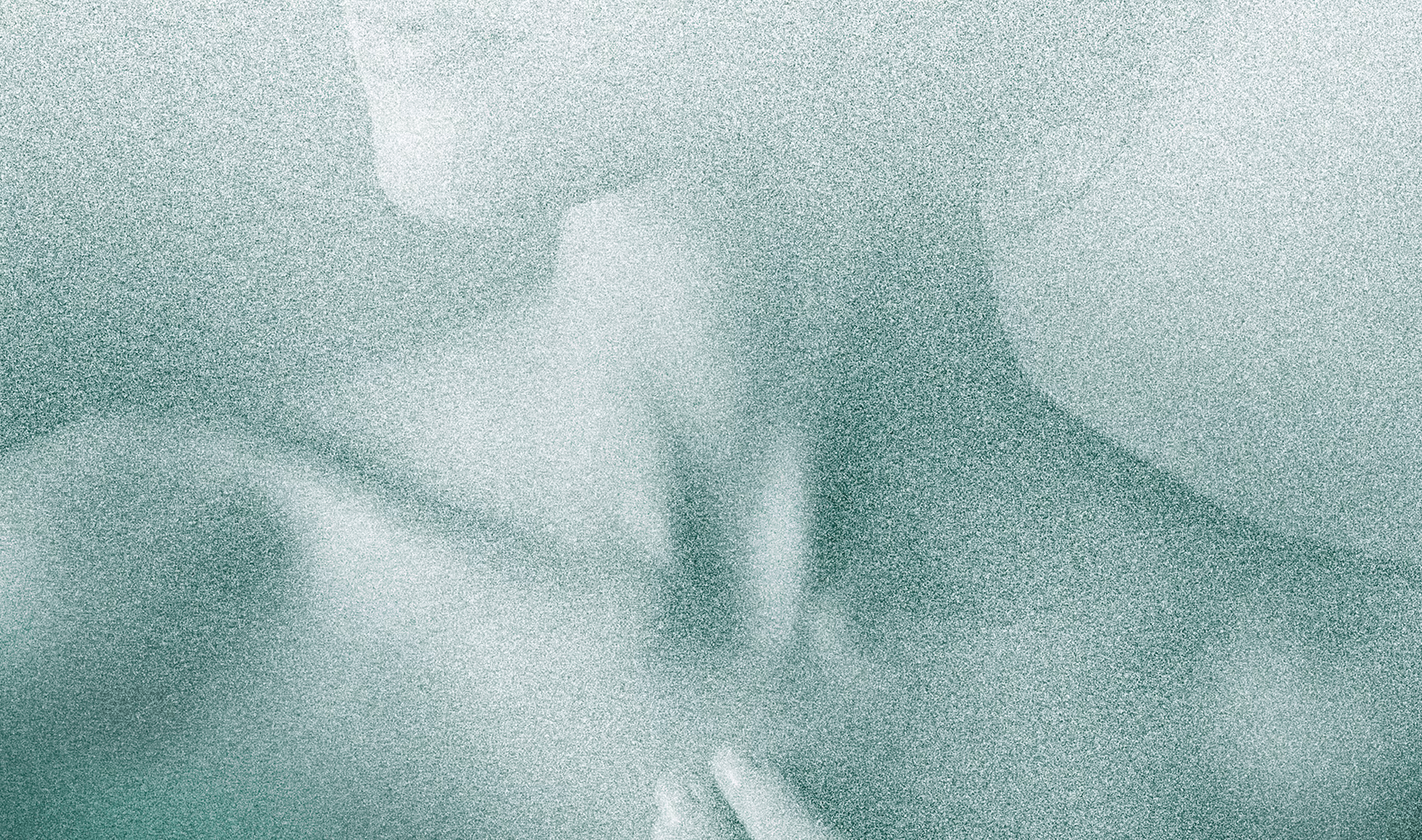 Misty close-up of a person's neck and chin enjoying a spa.